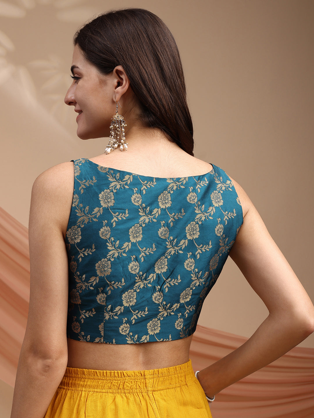 Teal colour brocade sleeveless blouse